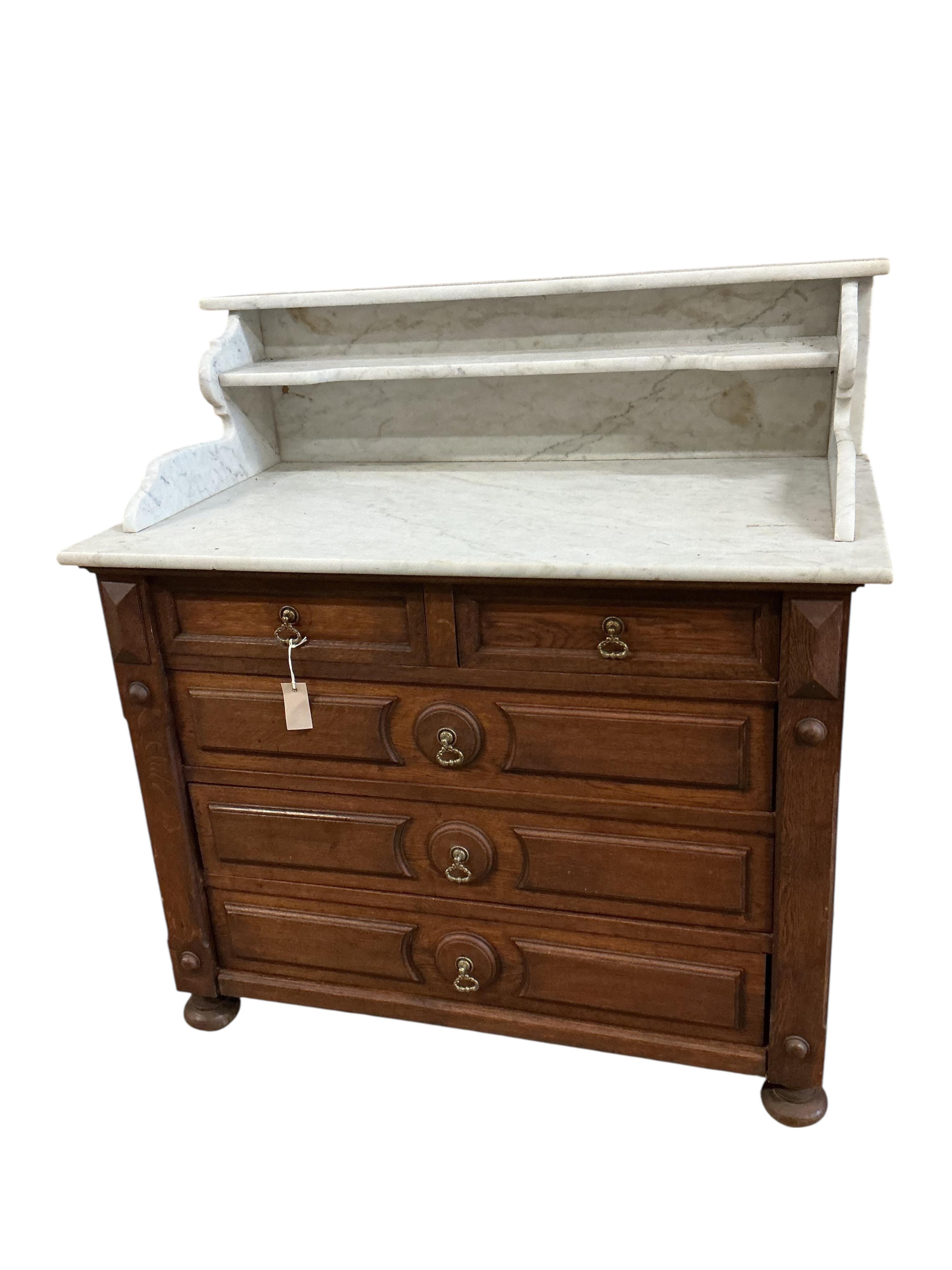 A late 19th century French oak marble top washstand, width 106cm, depth 58cm, height 112cm